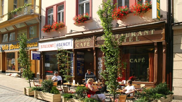 A building with a café on the ground floor, a student agency on the second floor, and a restaurant on the third floor.