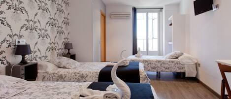 Triple Room, Private Bathroom | Blackout drapes, soundproofing, iron/ironing board, free WiFi