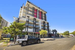 A multi-story building with balconies and a sign reading "The Chermside Apartments." - The Chermside Apartments (Chermside)