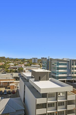 A modern building with multiple floors and large windows. - The Chermside Apartments (Chermside)