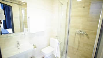 Standard Twin Room | Bathroom amenities | Shower, hair dryer, slippers, towels