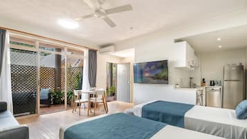 Studio, 2 Twin Beds | Living area | Flat-screen TV
