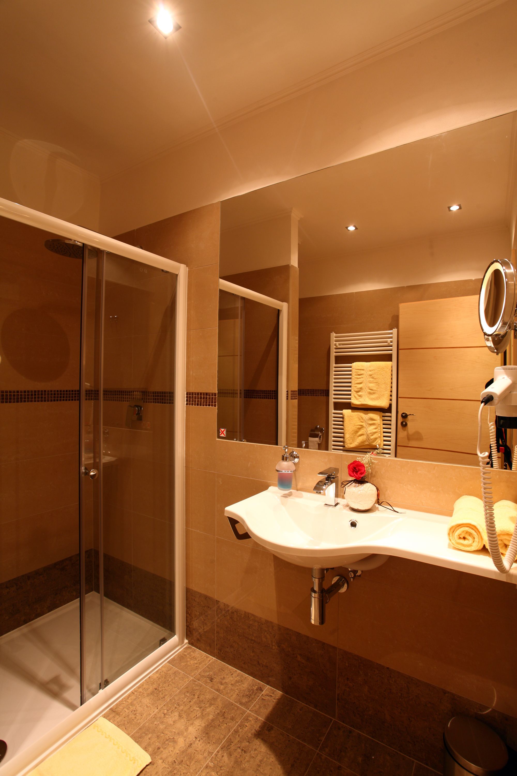deluxe double room | bathroom | rainfall showerhead, hair dryer, bathrobes, towels