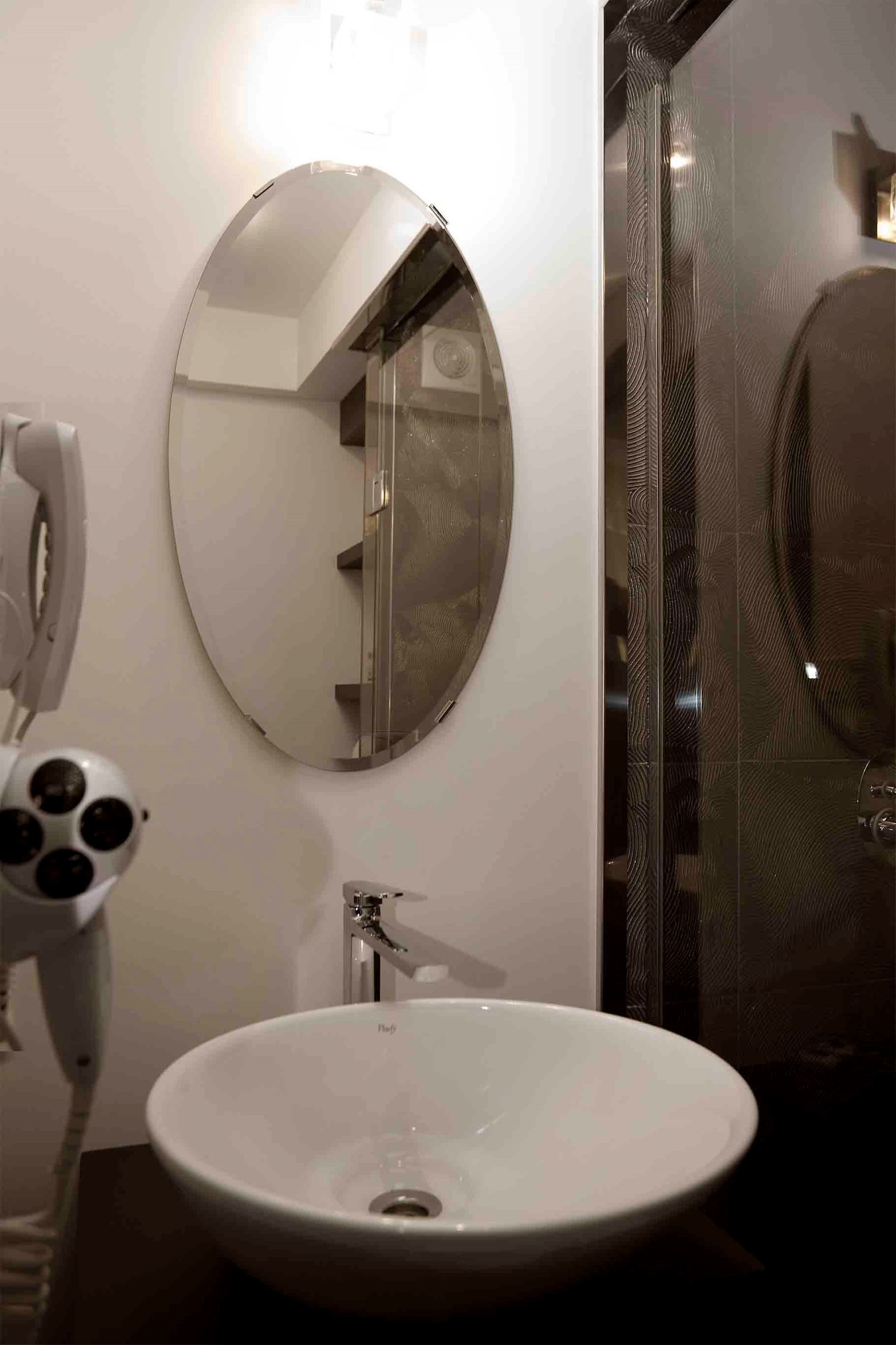 shower, designer toiletries, hair dryer, slippers