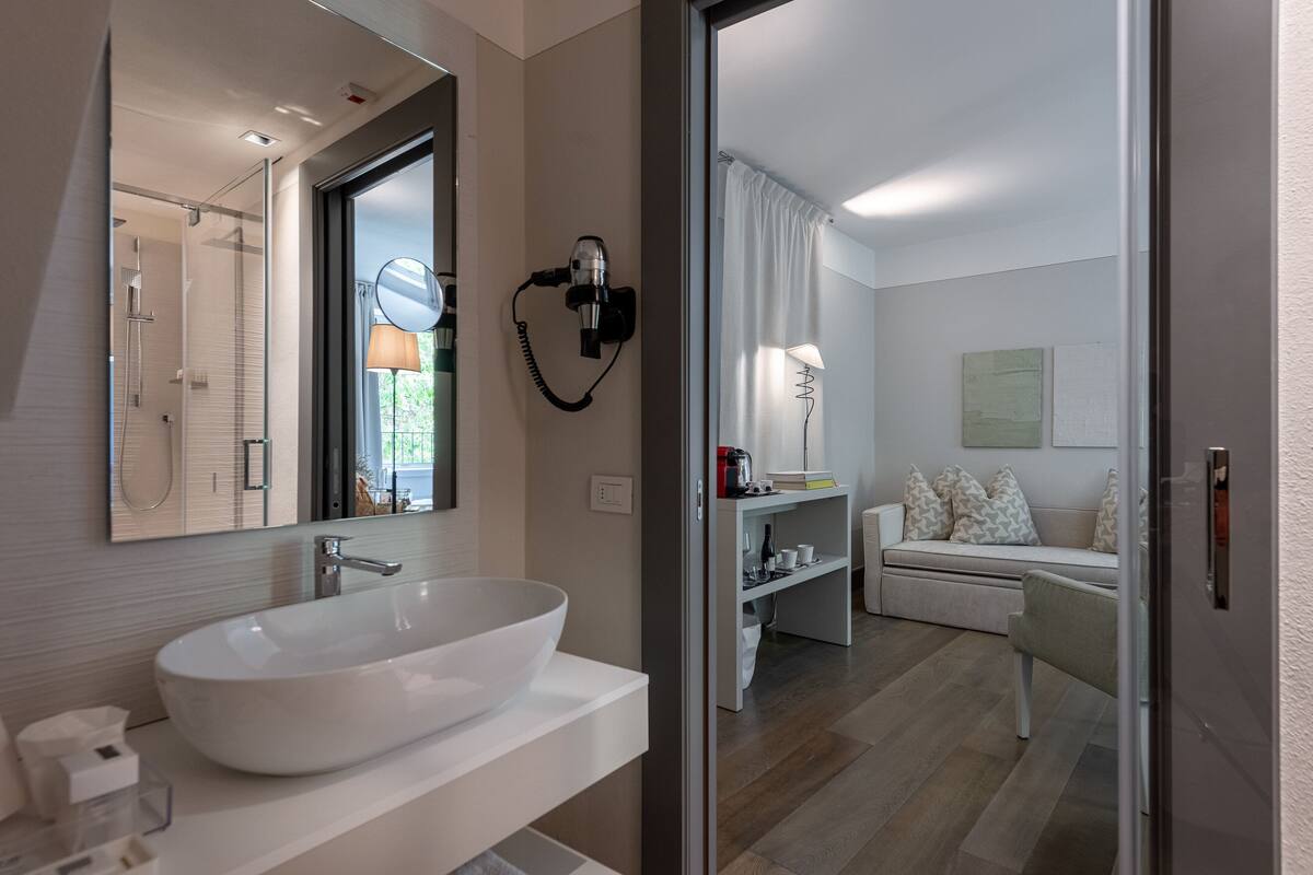 family suite | bathroom | shower, free toiletries, hair dryer, slippers