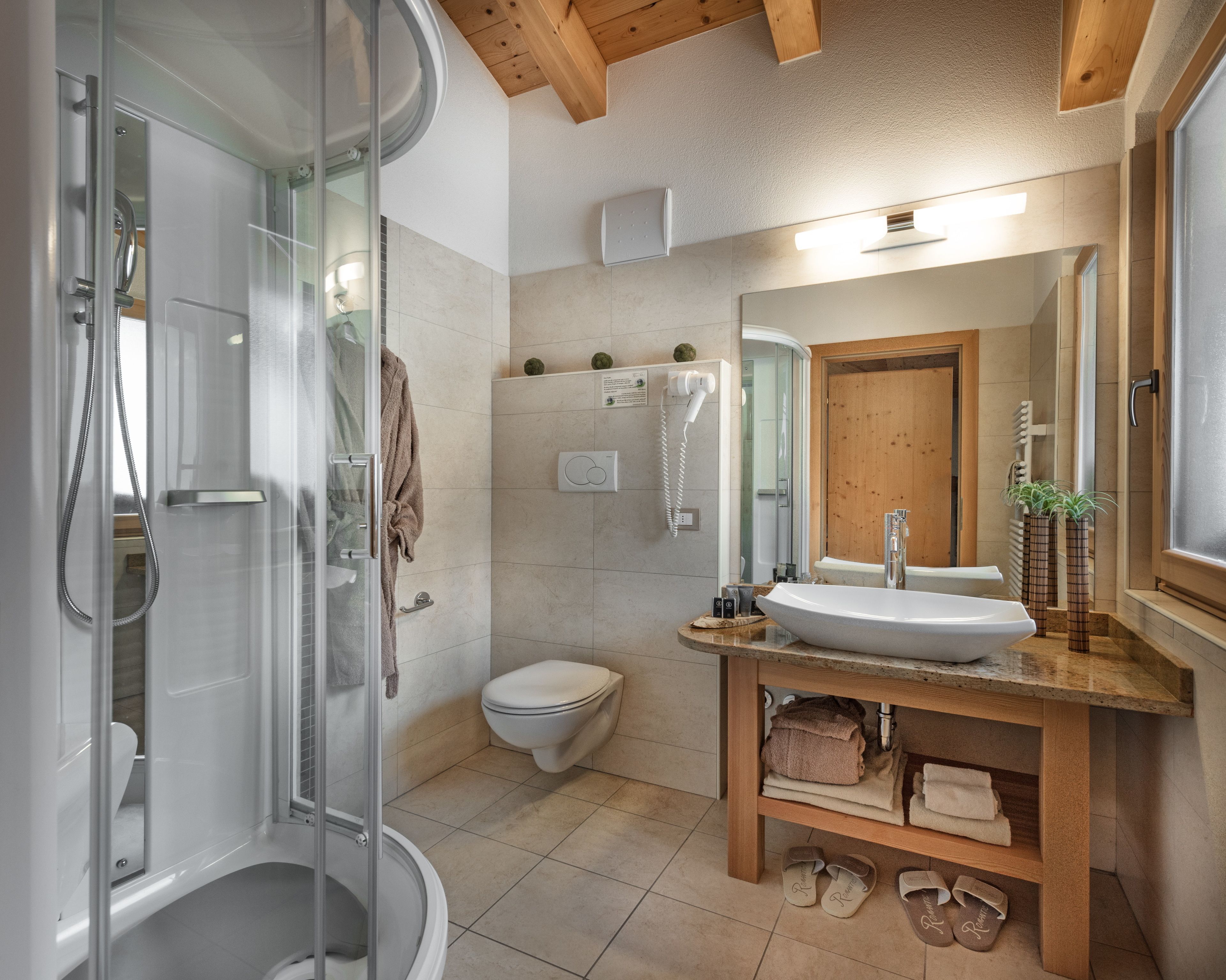 rainfall showerhead, designer toiletries, hair dryer, bathrobes