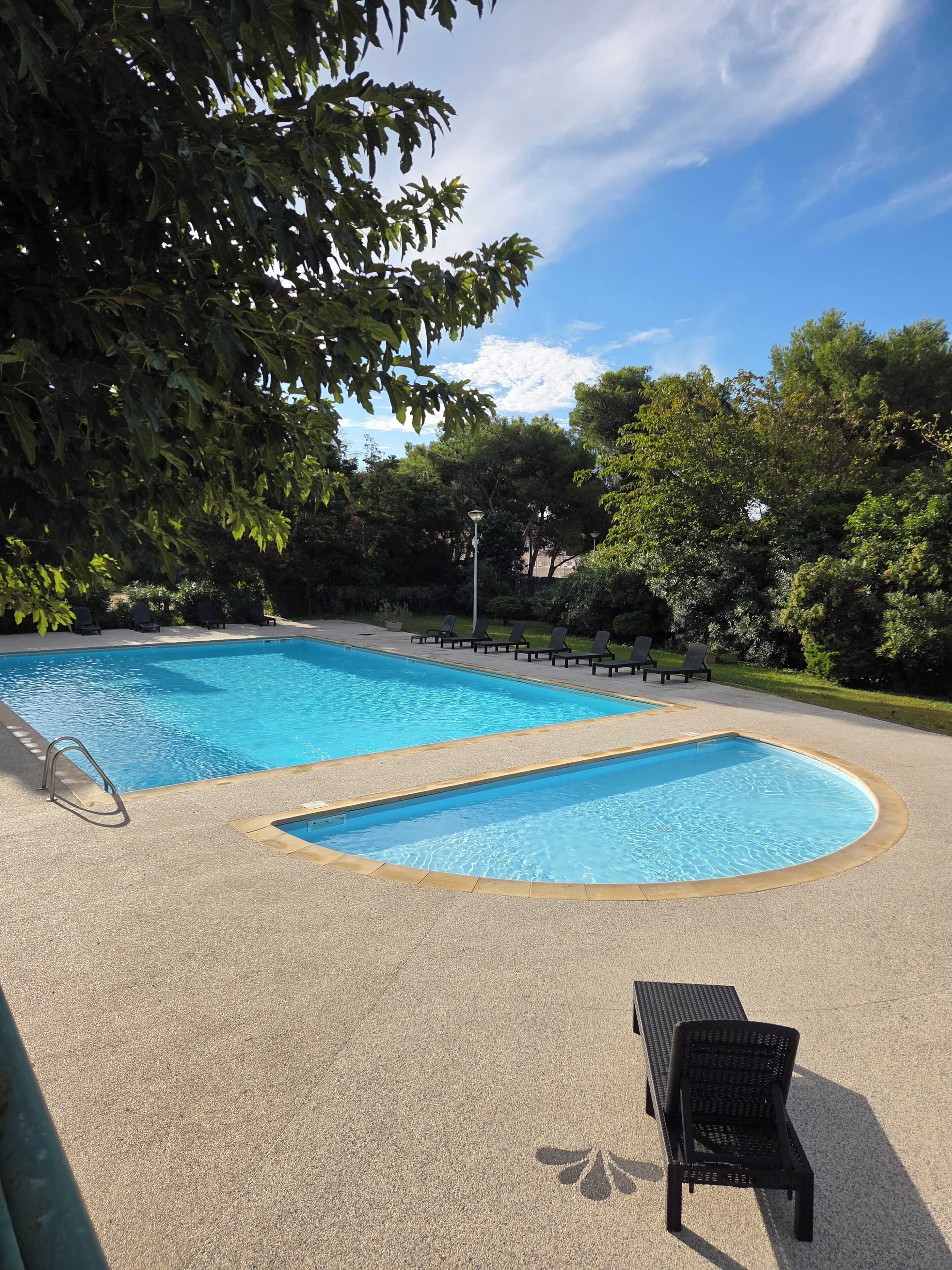 Seasonal outdoor pool, open 10:00 AM to 9:00 PM, pool loungers