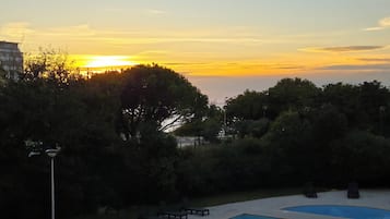 Seasonal outdoor pool, open 10:00 AM to 9:00 PM, pool loungers