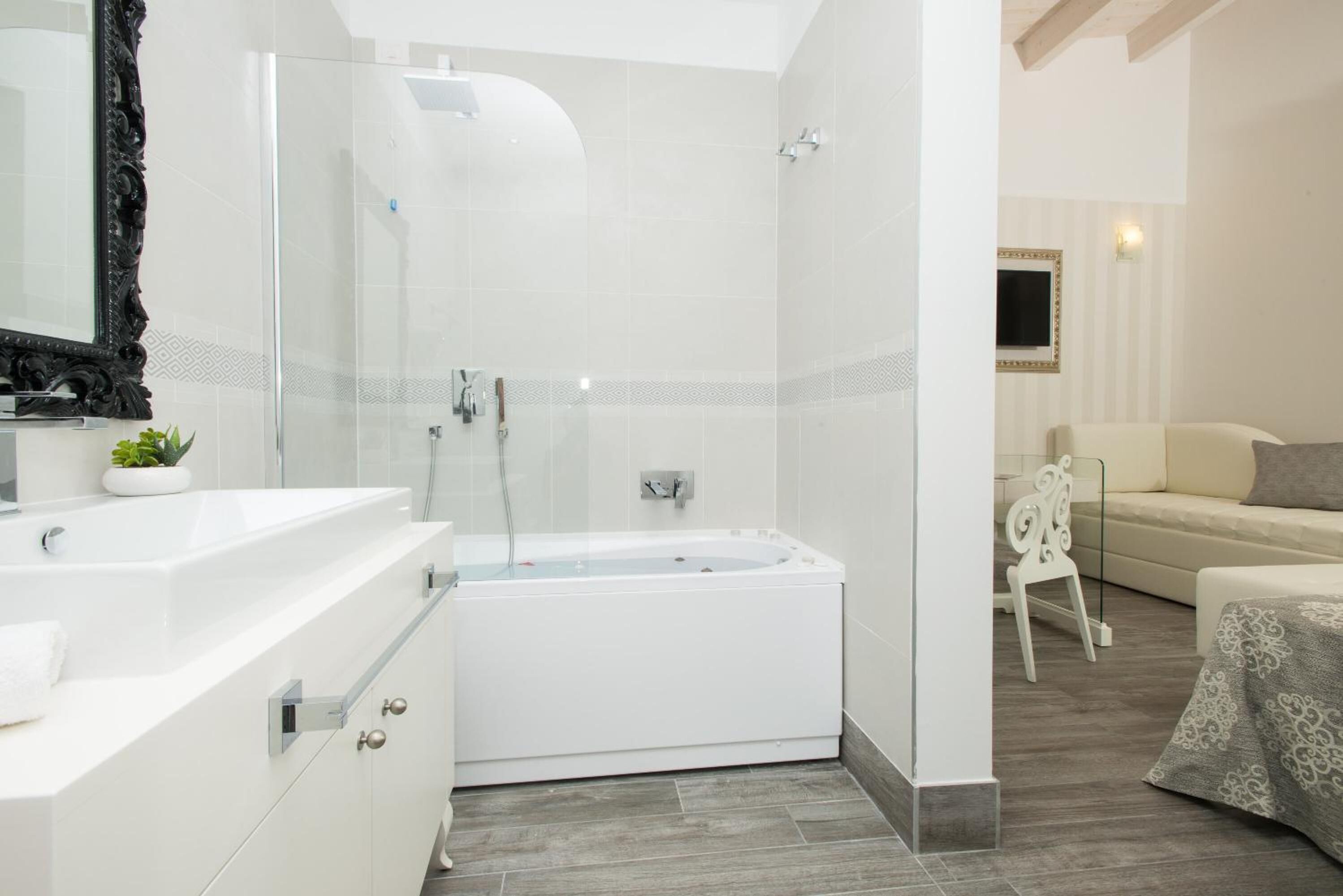 junior suite | bathroom | hair dryer, bidet, towels