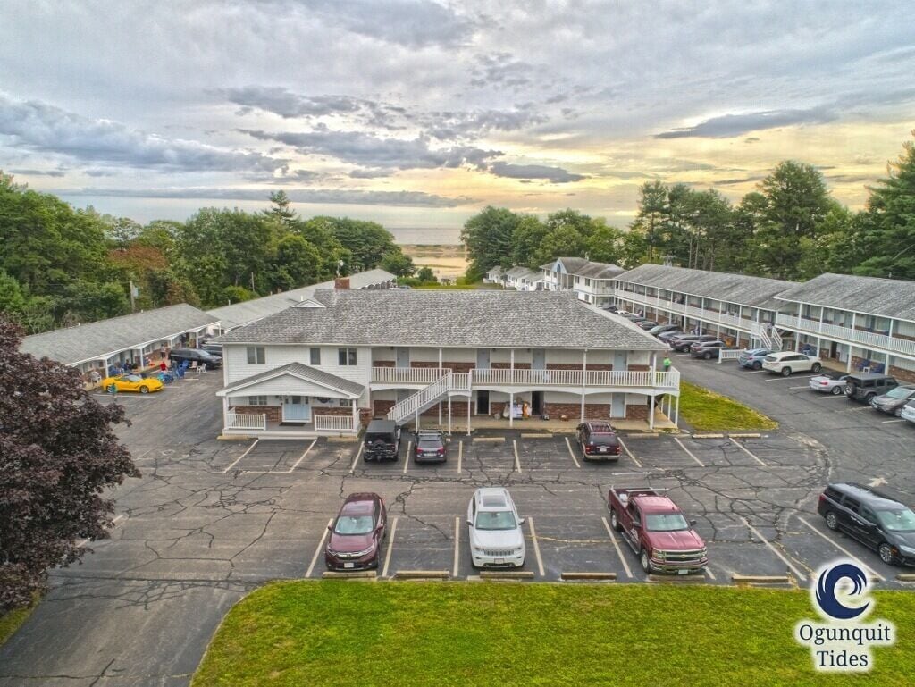 A motel with a central building and attached parking.