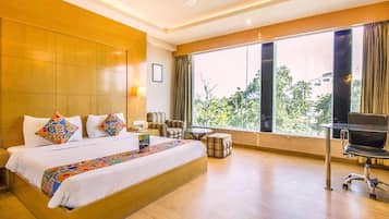 Deluxe Room | Premium bedding, minibar, in-room safe, individually decorated