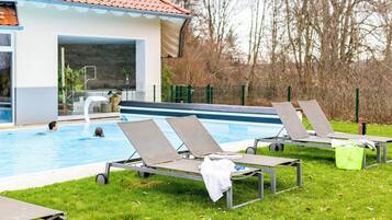 Outdoor pool, open 7:00 AM to 10:00 PM, pool umbrellas, pool loungers