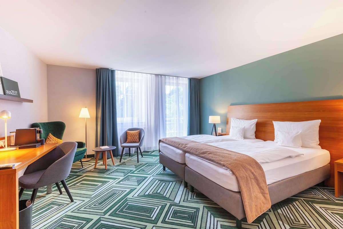 Hypo-allergenic bedding, in-room safe, desk, laptop workspace