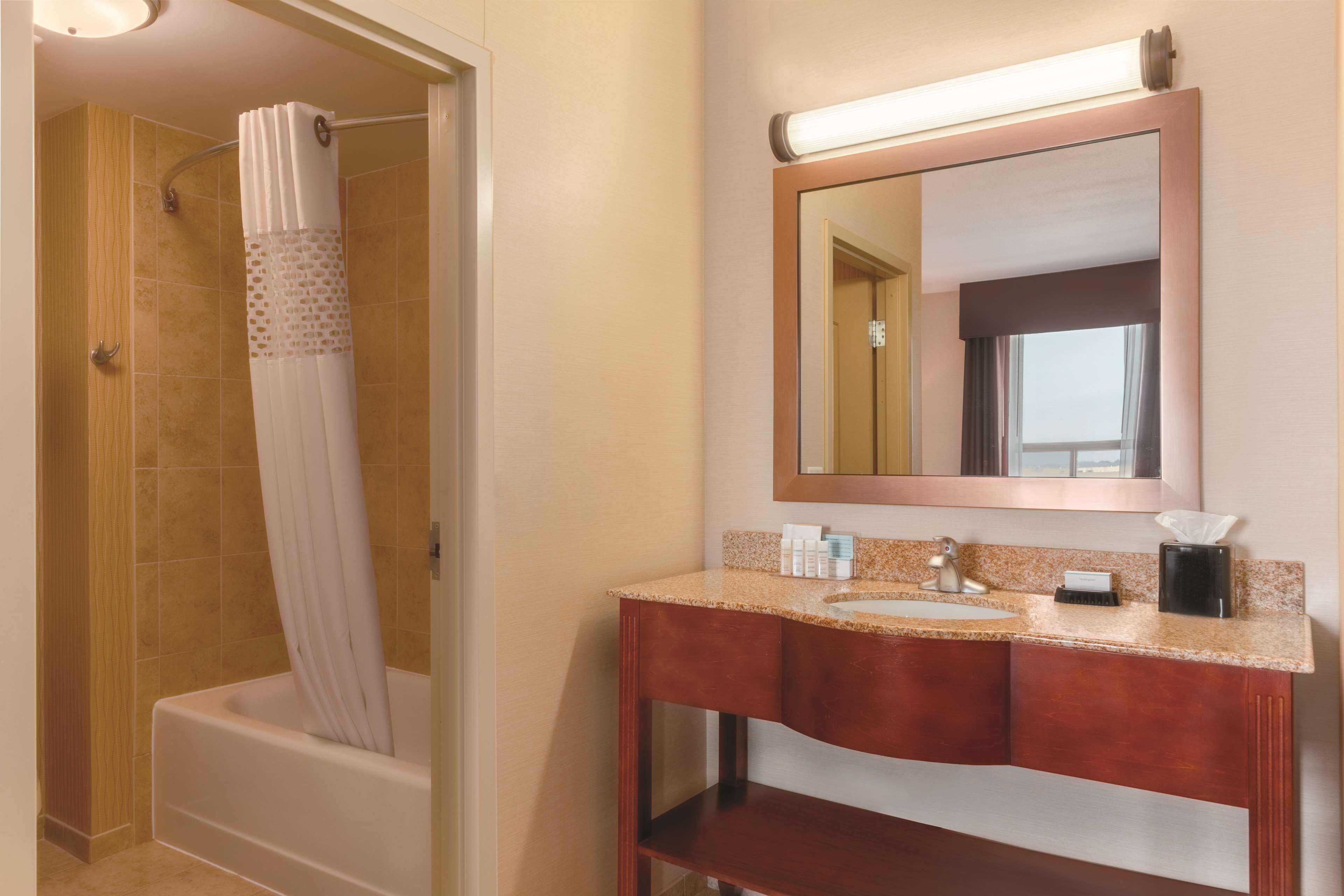 king studio suite | bathroom | shower, free toiletries, hair dryer, towels