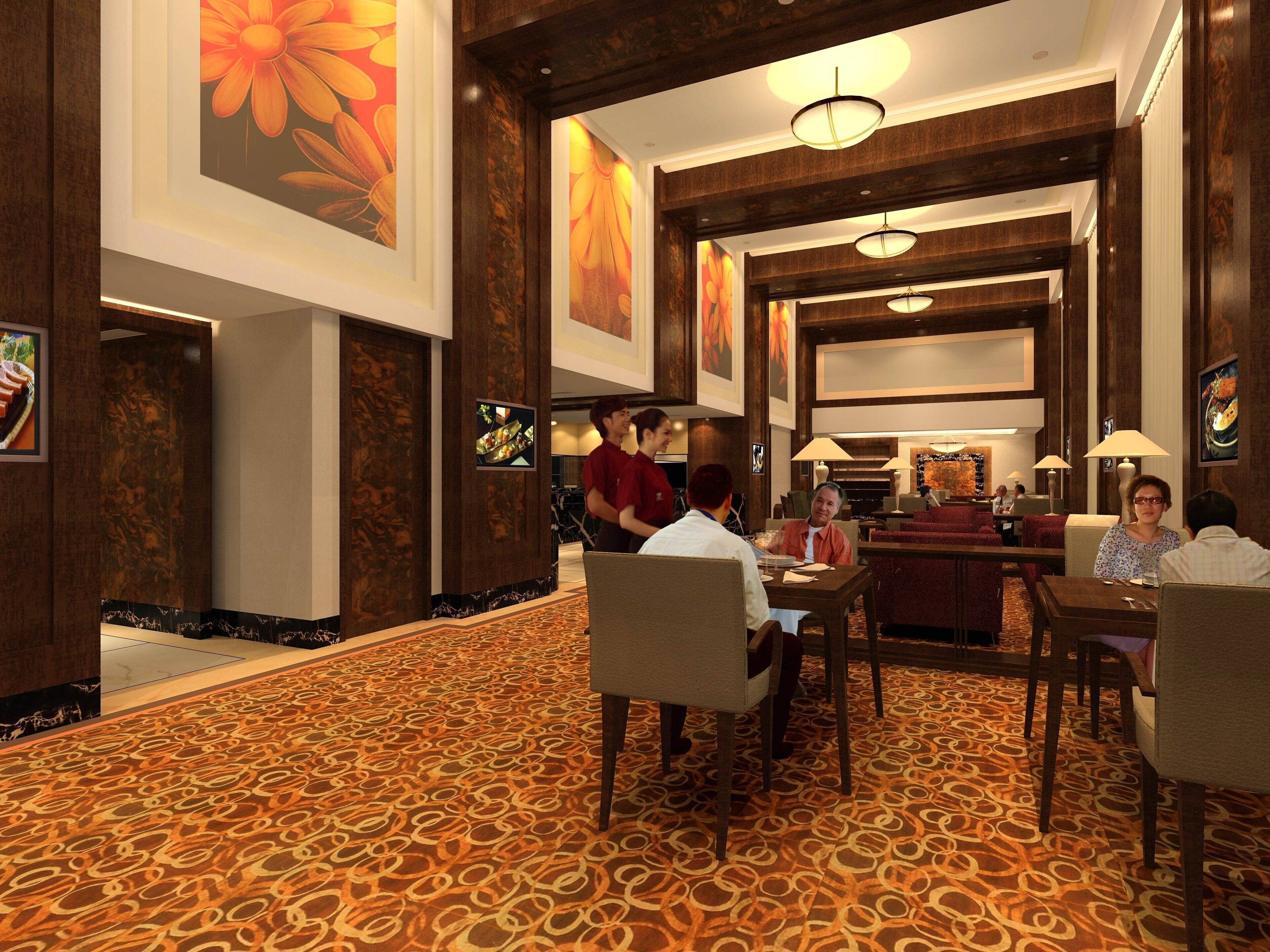 Un vestíbulo de hotel con alfombra estampada, paneles de madera y un gran cuadro floral en la pared.