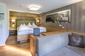 Deluxe Family Room, Balcony, Mountain View | Living area | 120-cm flat-screen TV with satellite channels, TV - Hotel Jäger (Tux)