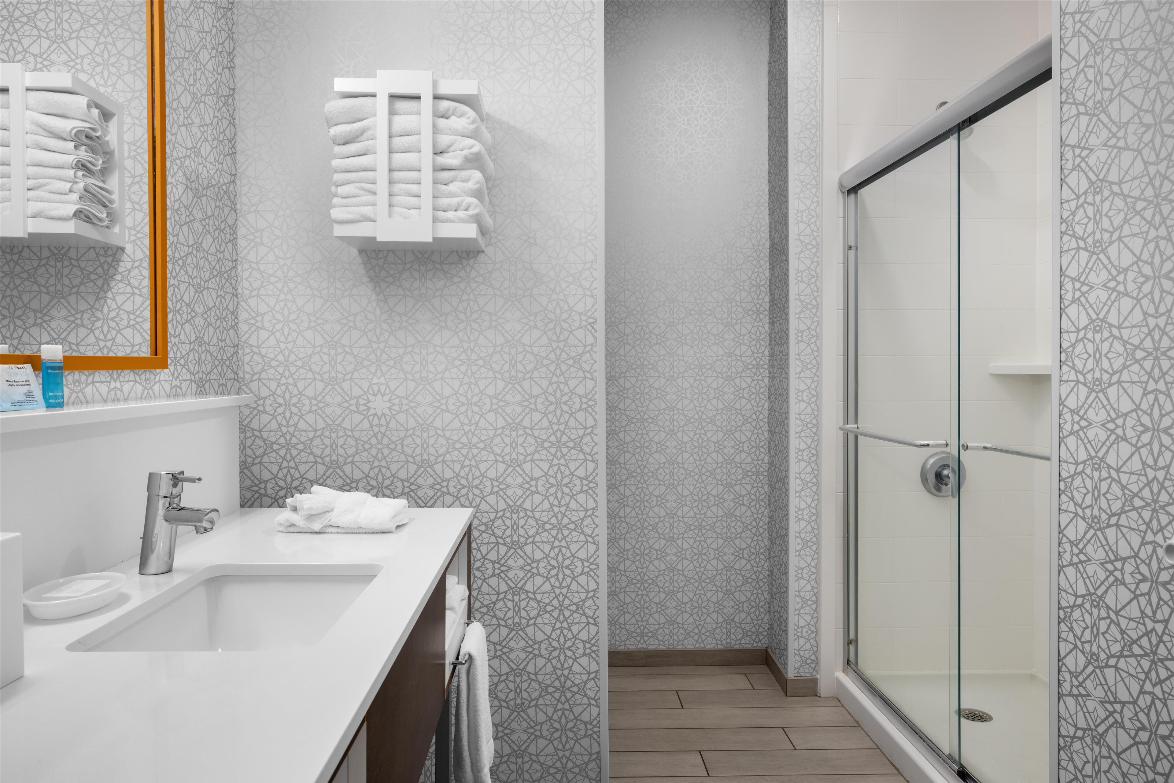 room, 1 king bed | bathroom | shower, free toiletries, hair dryer, towels