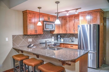 Full-size fridge, microwave, oven, stovetop at Stoneridge Mountain Resort