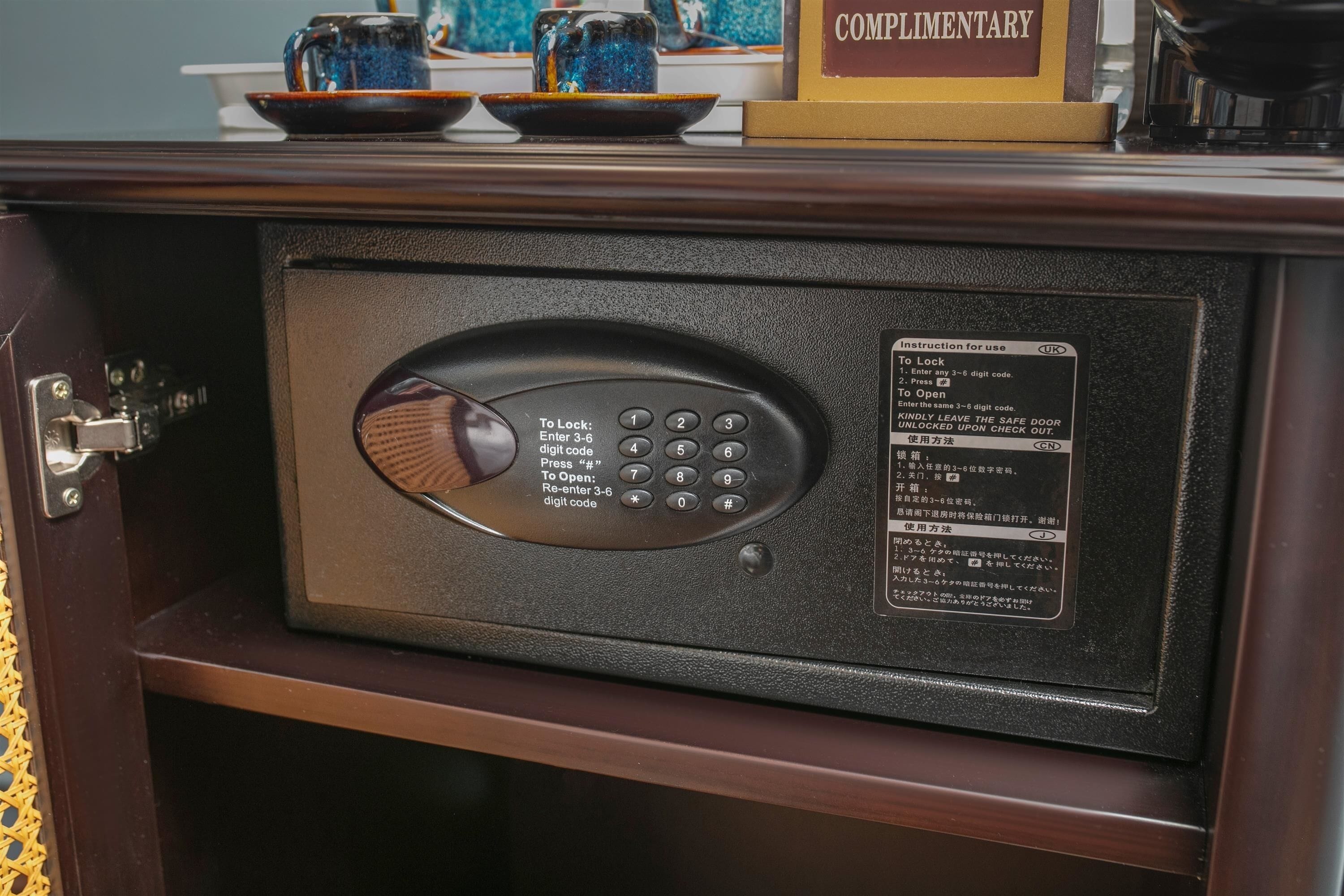A safe with a keypad and instructions for use.
