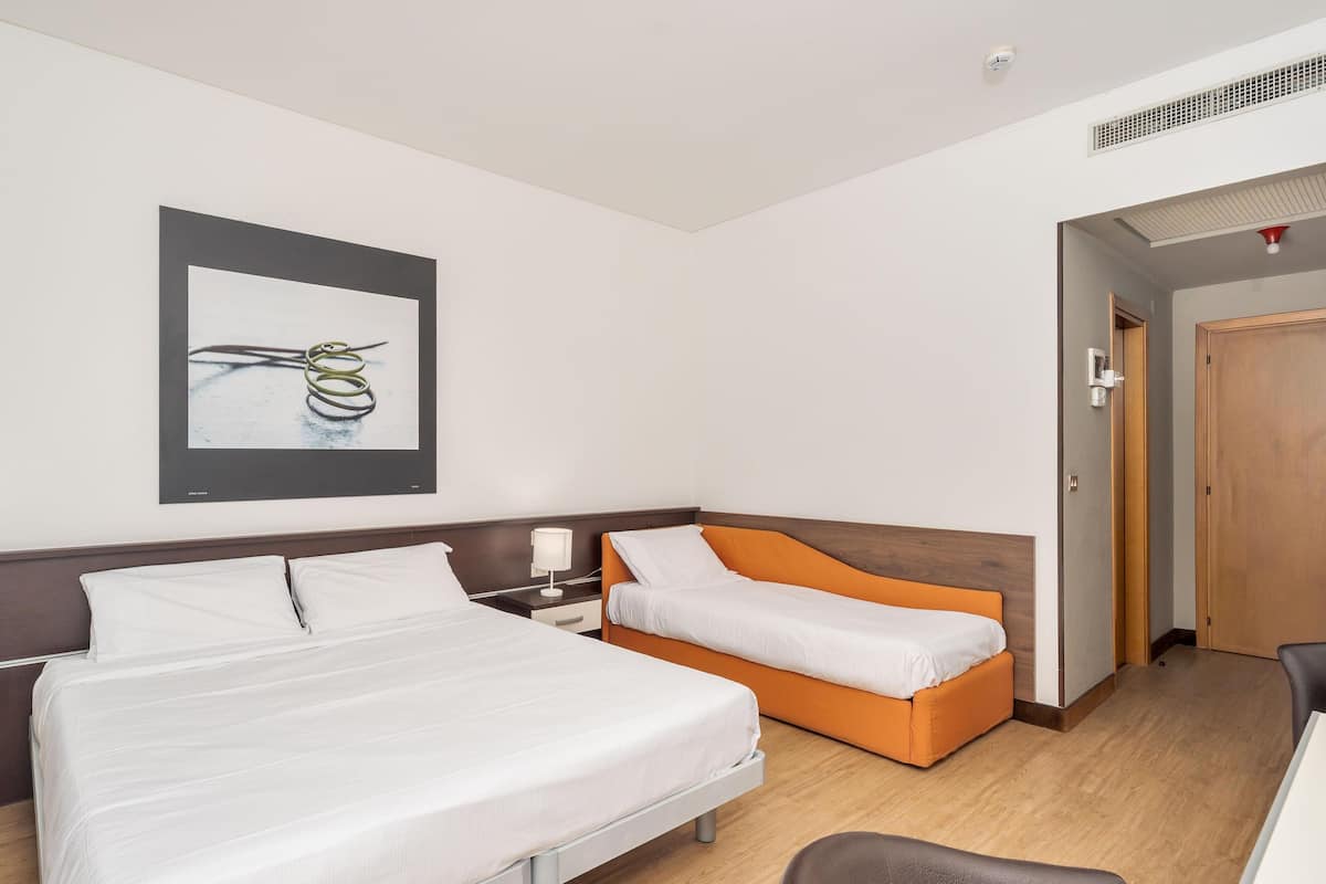 Superior Triple Room | Minibar, in-room safe, desk, soundproofing