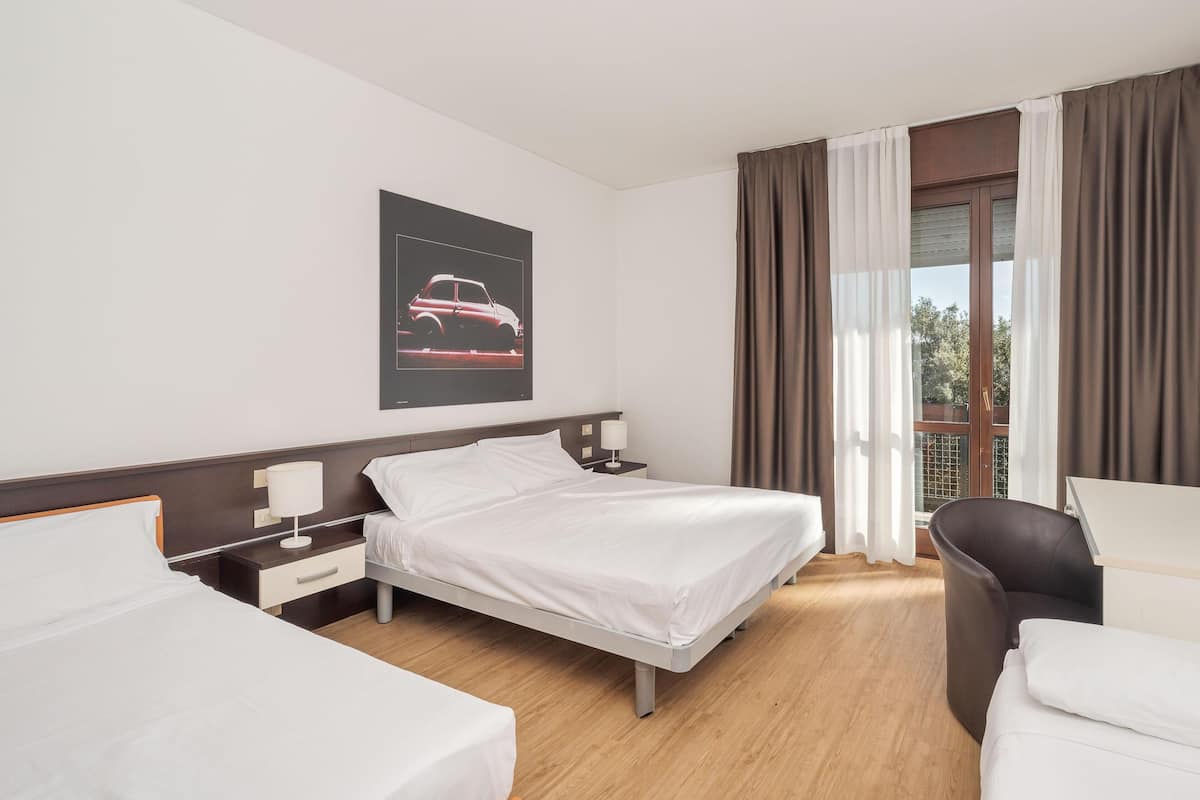 Standard Quadruple Room | Minibar, in-room safe, desk, soundproofing