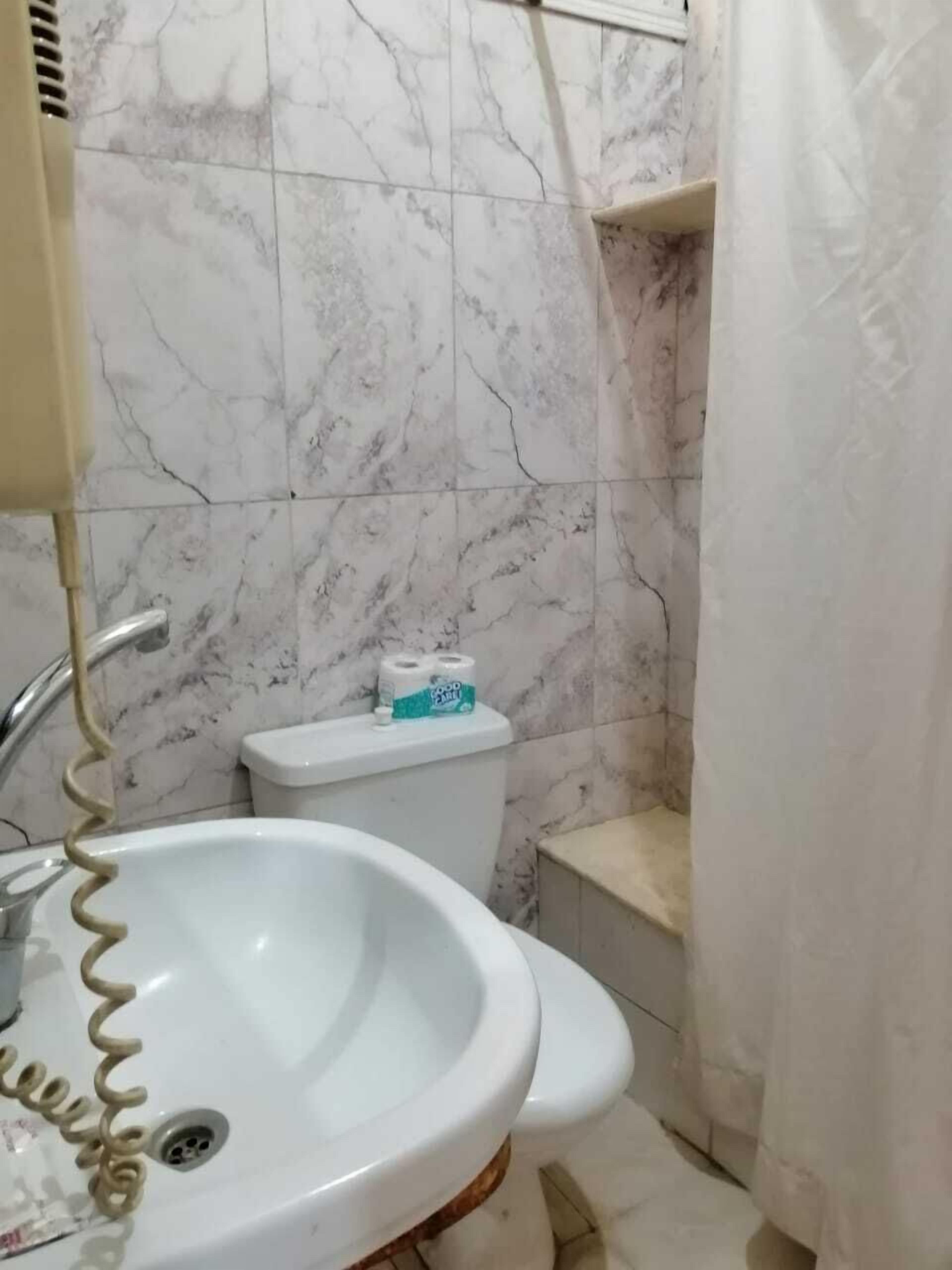 bathtub, free toiletries, hair dryer, towels