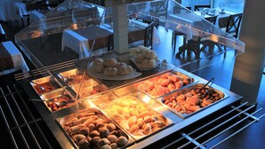 A buffet with various food items displayed in clear containers. - Eira do Serrado Hotel & SPA (Camara de Lobos)