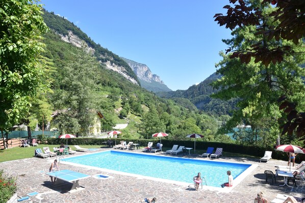 Seasonal outdoor pool, pool umbrellas, pool loungers
