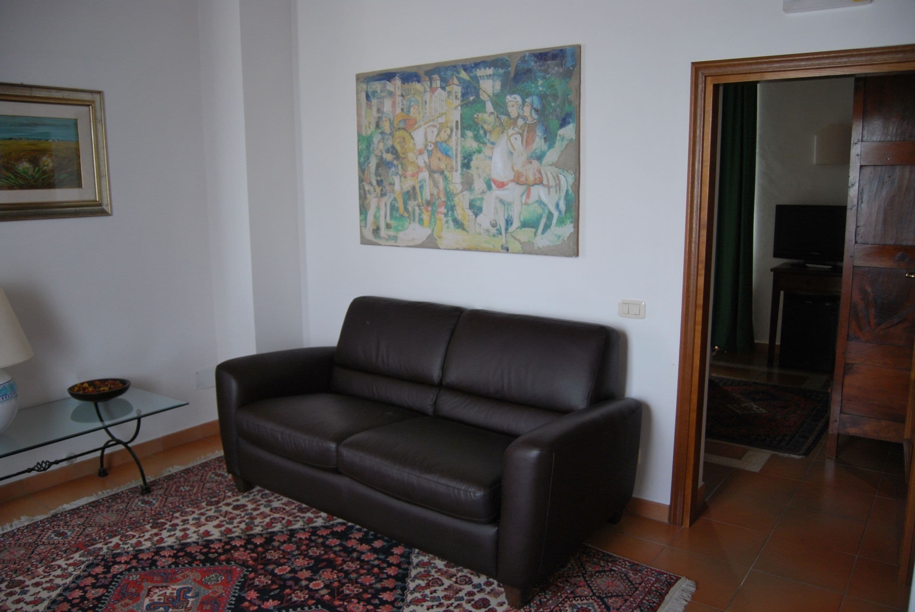 deluxe suite, 2 bedrooms | living room | smart tv