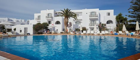 Seasonal outdoor pool, open 11:00 AM to 7:30 PM, pool umbrellas