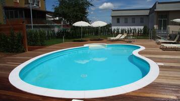 Seasonal outdoor pool, pool umbrellas, pool loungers