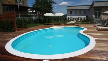 Seasonal outdoor pool, pool umbrellas, sun loungers