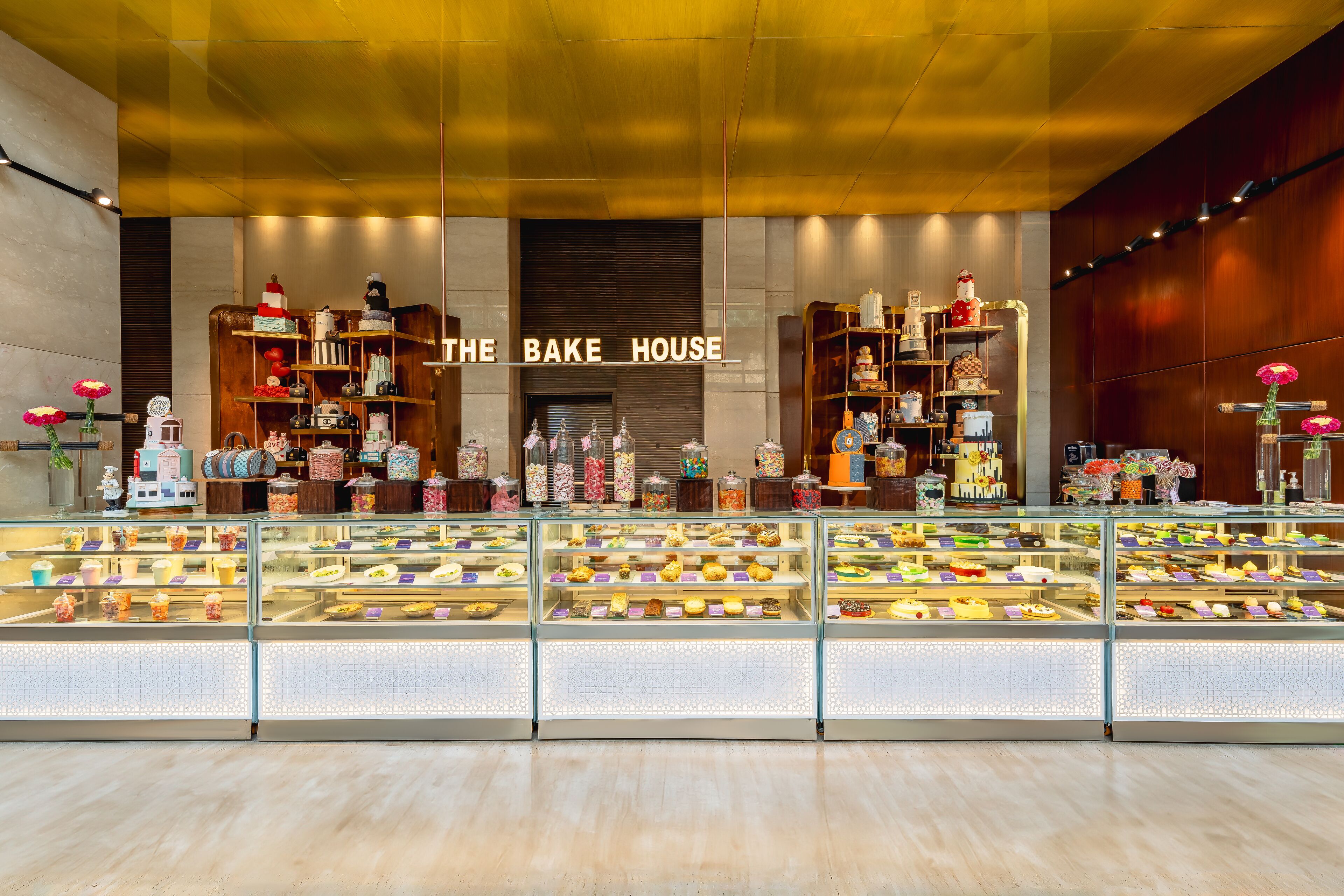 A bakery display with various baked goods and decorative items.