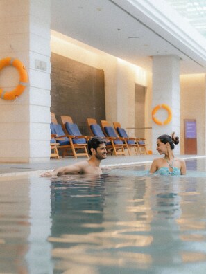 Indoor pool, open 6:00 AM to 8:00 PM, pool loungers