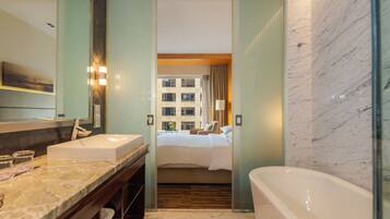 Room, 1 King Bed | Bathroom | Combined shower/tub, rainfall showerhead, free toiletries, hair dryer