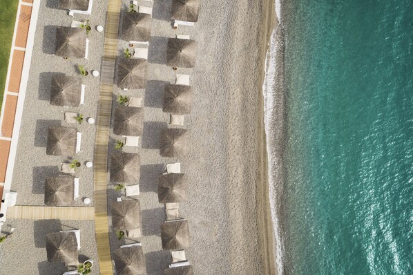 On the beach, sun-loungers, sailing
