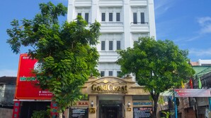 A hotel named "Gold Coast" with a classic architectural style, featuring a prominent entrance and visible signage for a restaurant and bar. - Gold Coast Da Nang Hotel (Da Nang)
