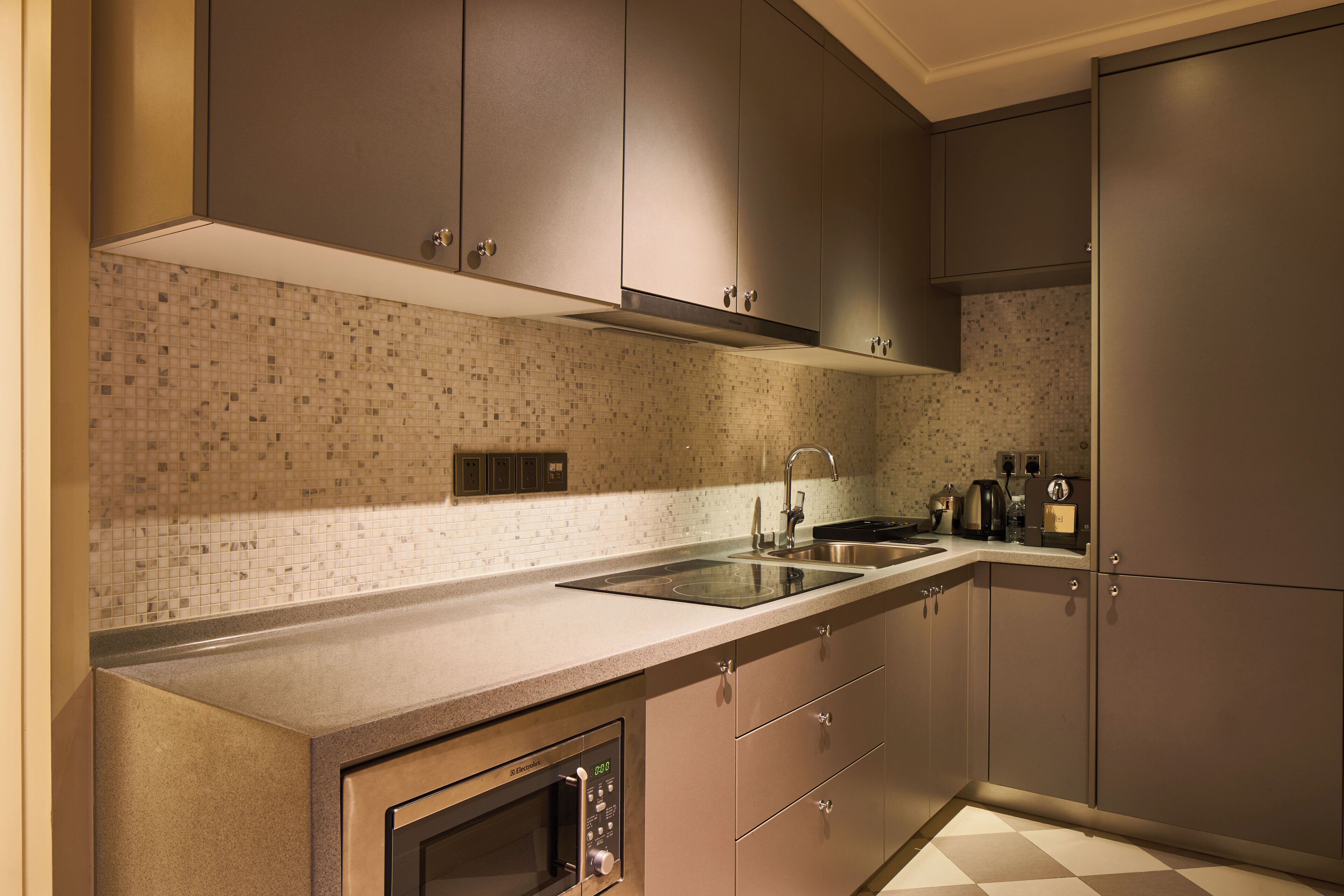 fridge, coffee/tea maker, cookware/dishes/utensils