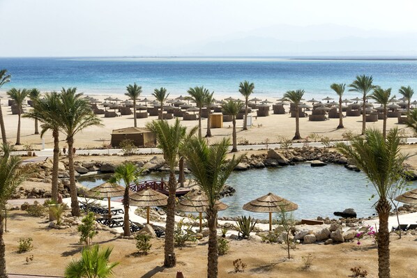 On the beach, free beach cabanas, sun-loungers, beach umbrellas