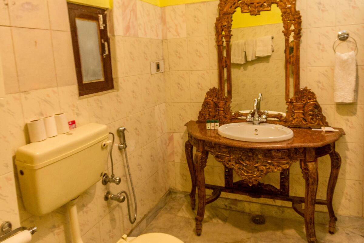 deluxe room | bathroom | designer toiletries, hair dryer, slippers, towels