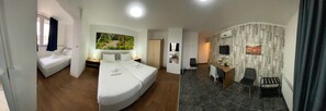 A hotel room with a bed, a desk, a chair, a TV, and a bathroom. - Silver Hotel Budapest City Center (Budapest)