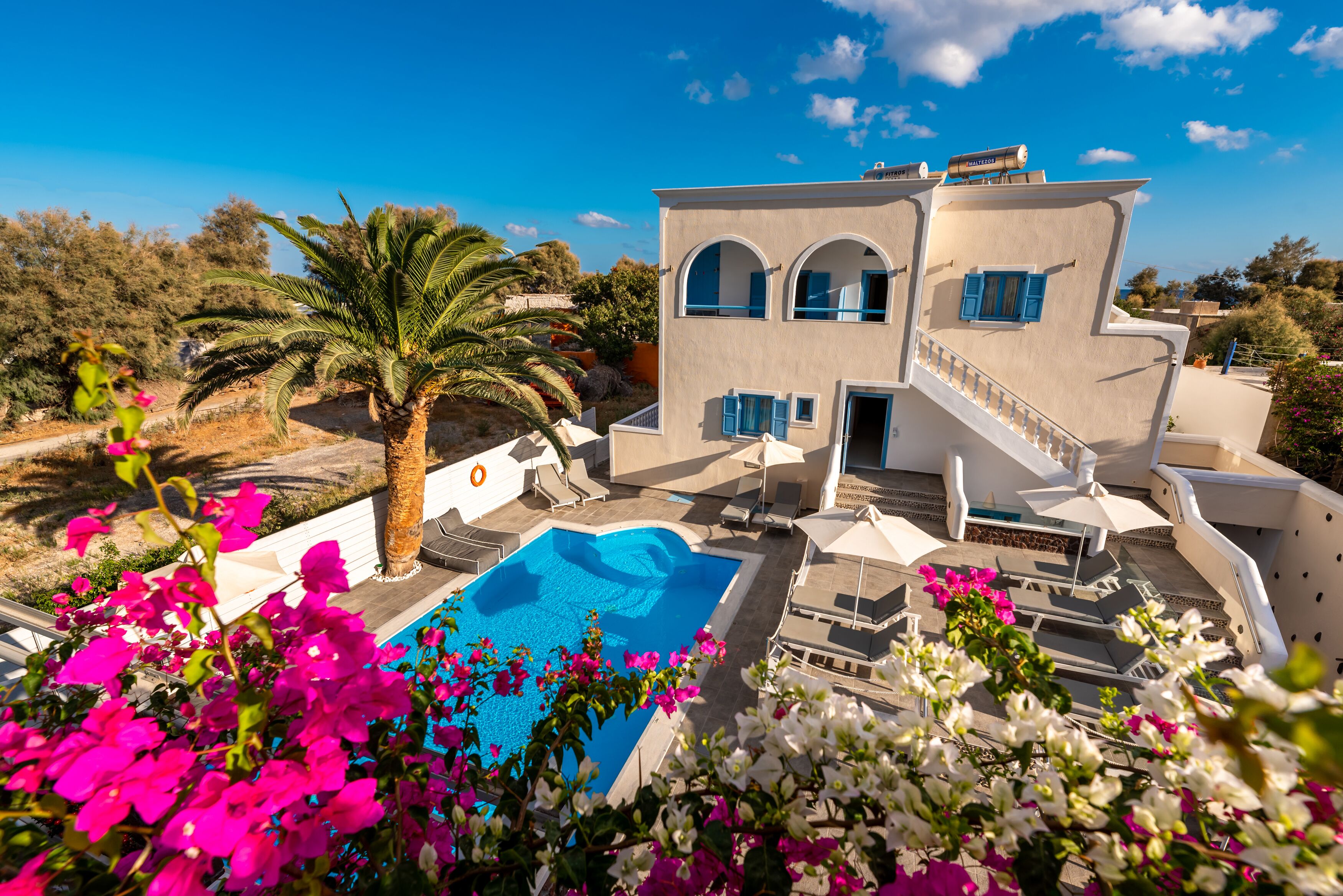 outdoor pool, open 9:00 am to 9:00 pm, pool umbrellas, pool loungers