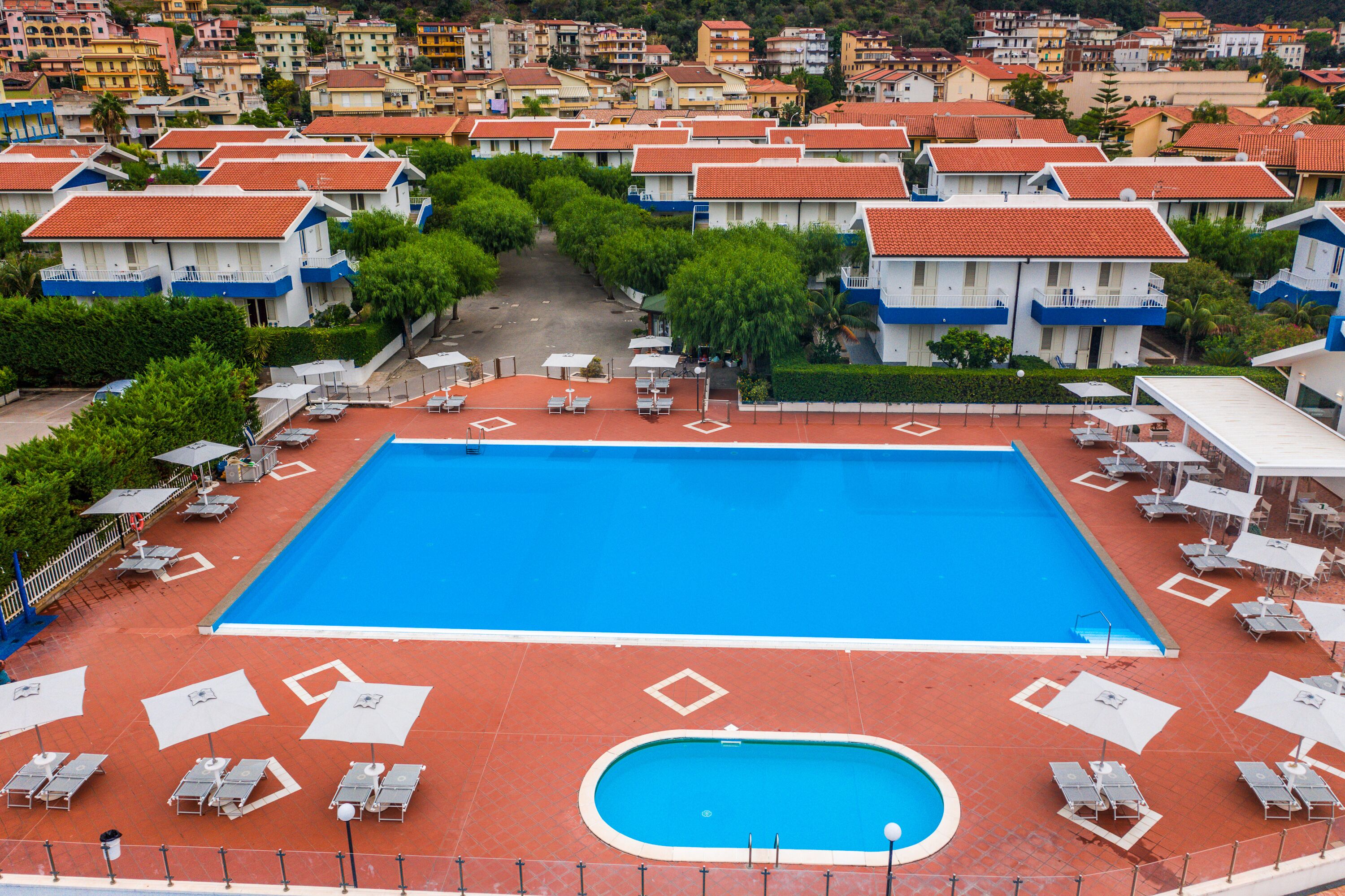 Seasonal outdoor pool, open 9:30 AM to 7:30 PM, pool umbrellas