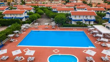 Seasonal outdoor pool, open 9:30 AM to 7:30 PM, pool umbrellas