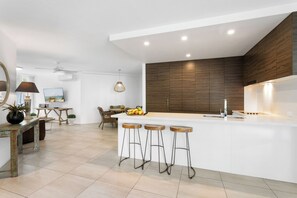 Two Bedroom Ground Floor Apartment with Spa | Private kitchen | Full-size fridge, microwave, oven, stovetop - Noosa Tropicana (Noosaville)