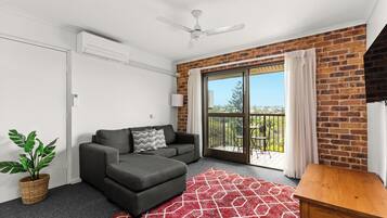 Executive 1 Bedroom Apartment | Living area | 43-inch flat-screen TV with digital channels, TV