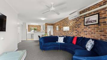 Executive 2 Bedroom Apartment | Living area | 43-inch flat-screen TV with digital channels, TV
