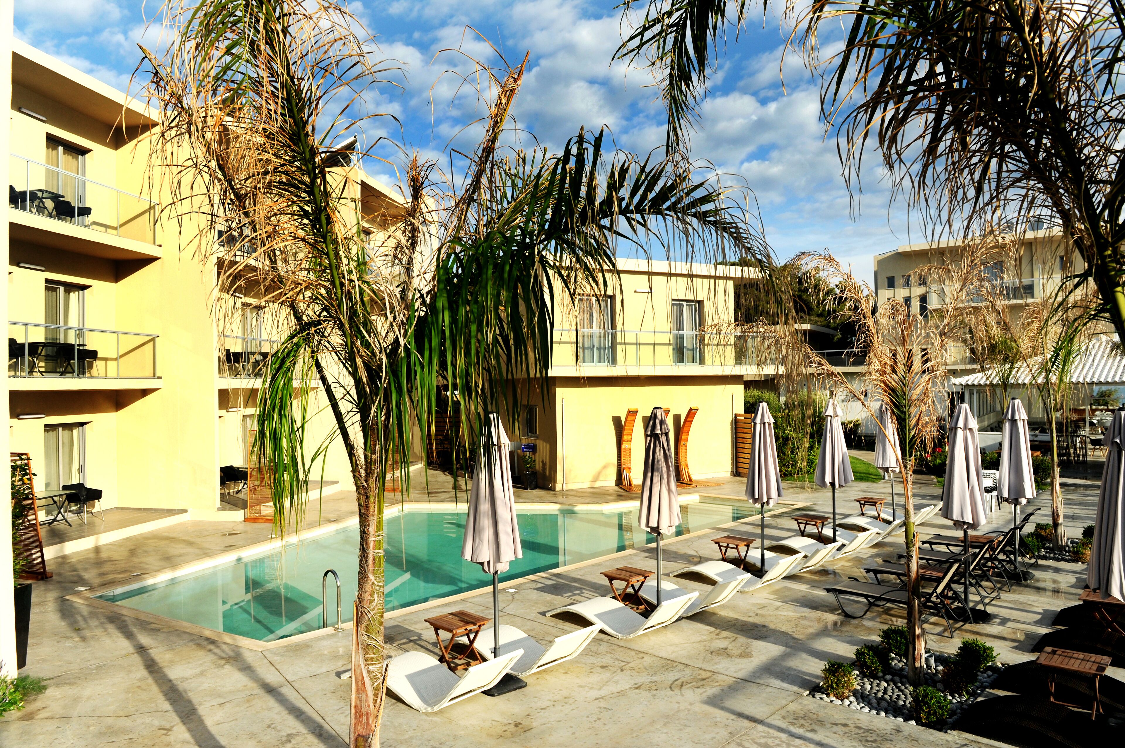 seasonal outdoor pool, pool umbrellas, pool loungers