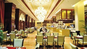 A spacious hotel lobby with a large chandelier, multiple seating areas, and a central bar. - Wyndham Grand Plaza Royale Palace Chengdu (Chengdu)