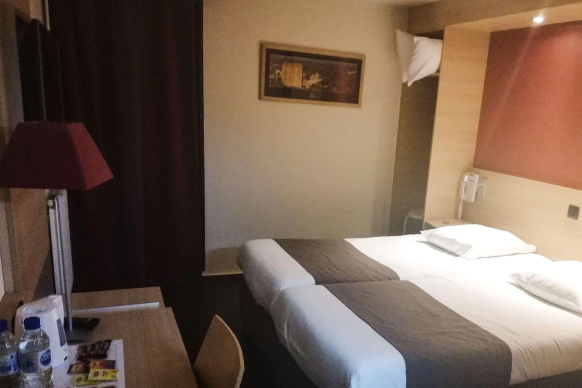 Desk, blackout drapes, WiFi (free), bed sheets